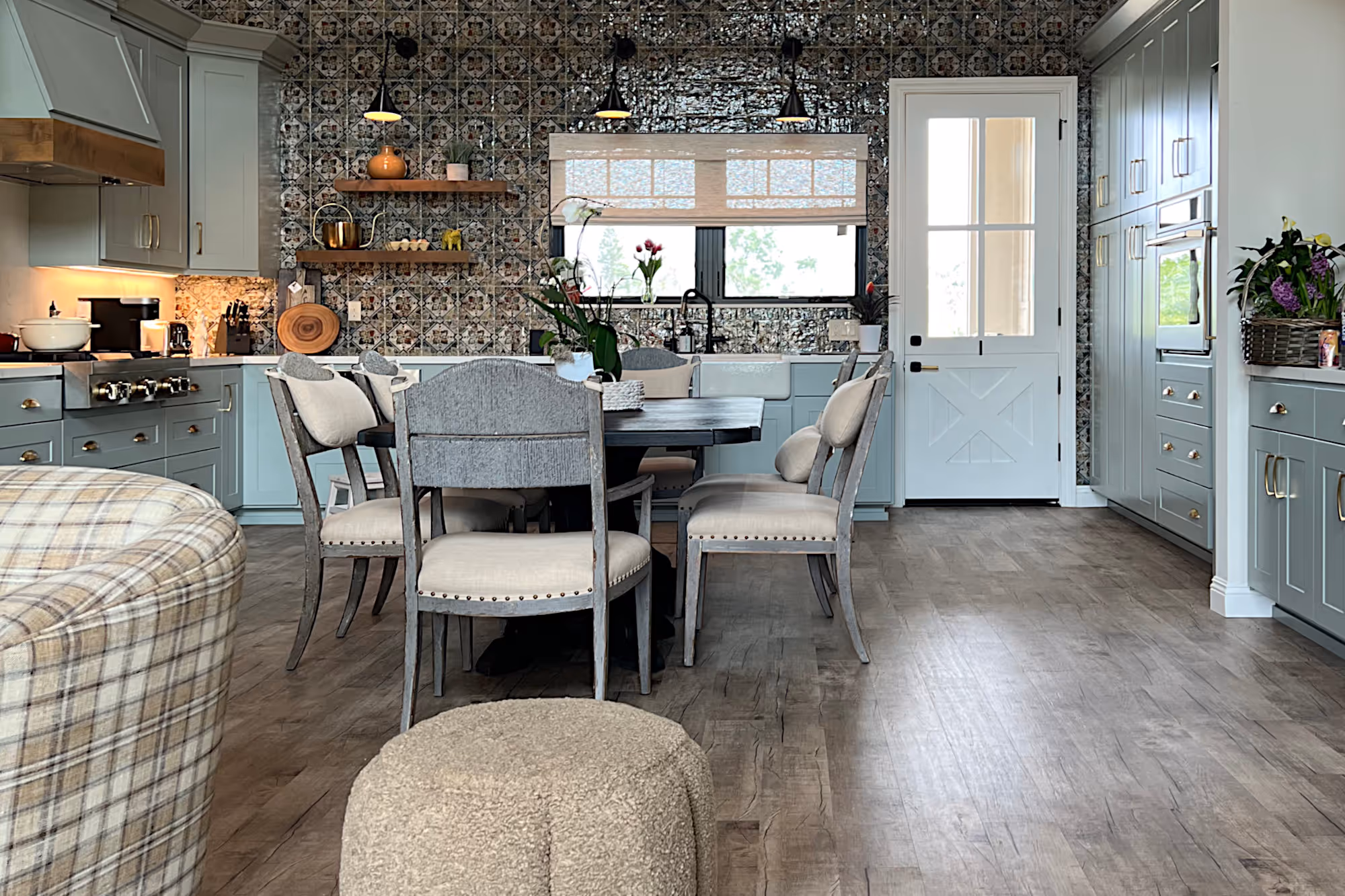 Napa valley farmhouse style kitchen with handmade green wall tile and wood beams.