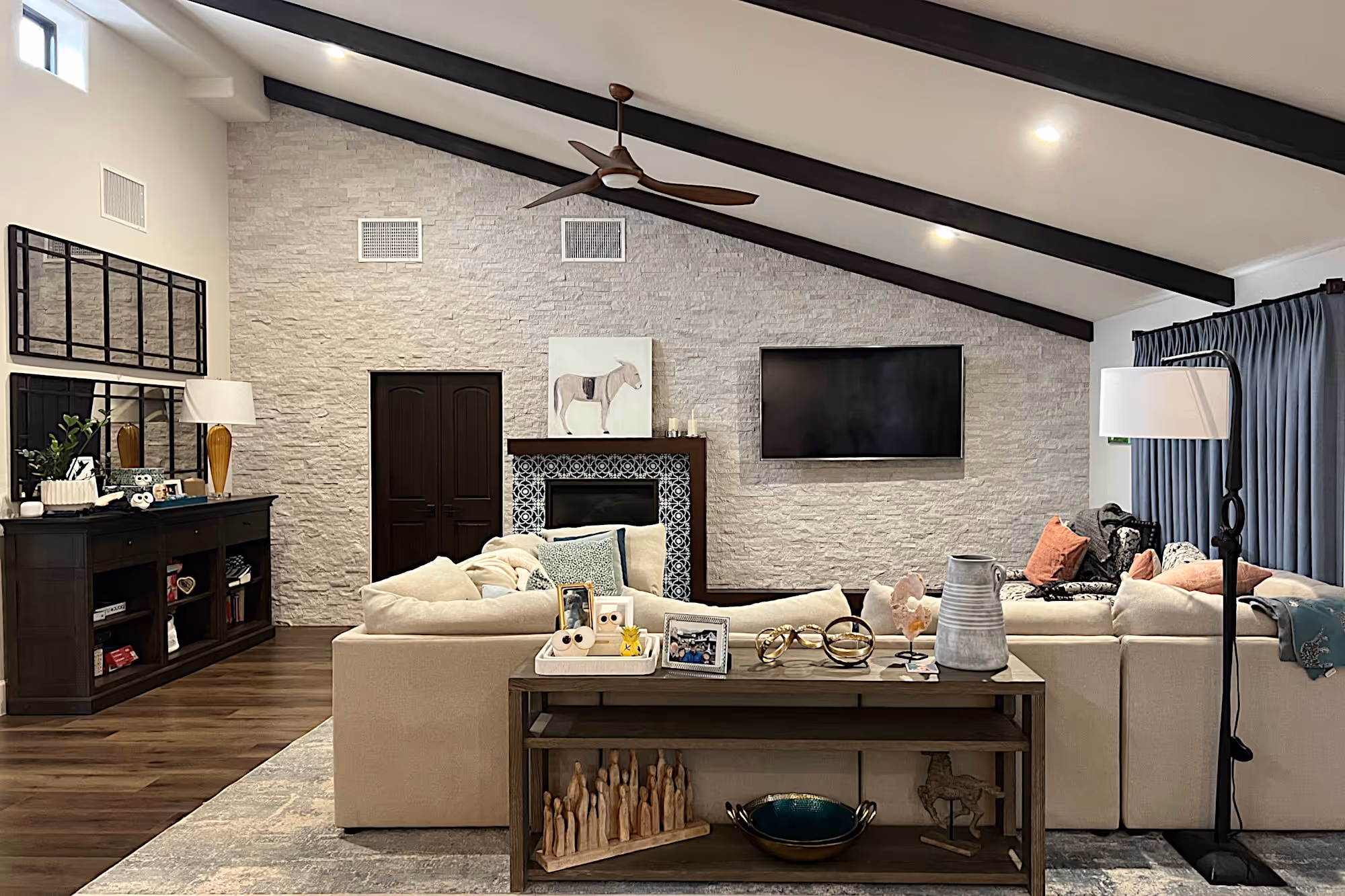 A Spanish style family room with cream and blue furnishings.