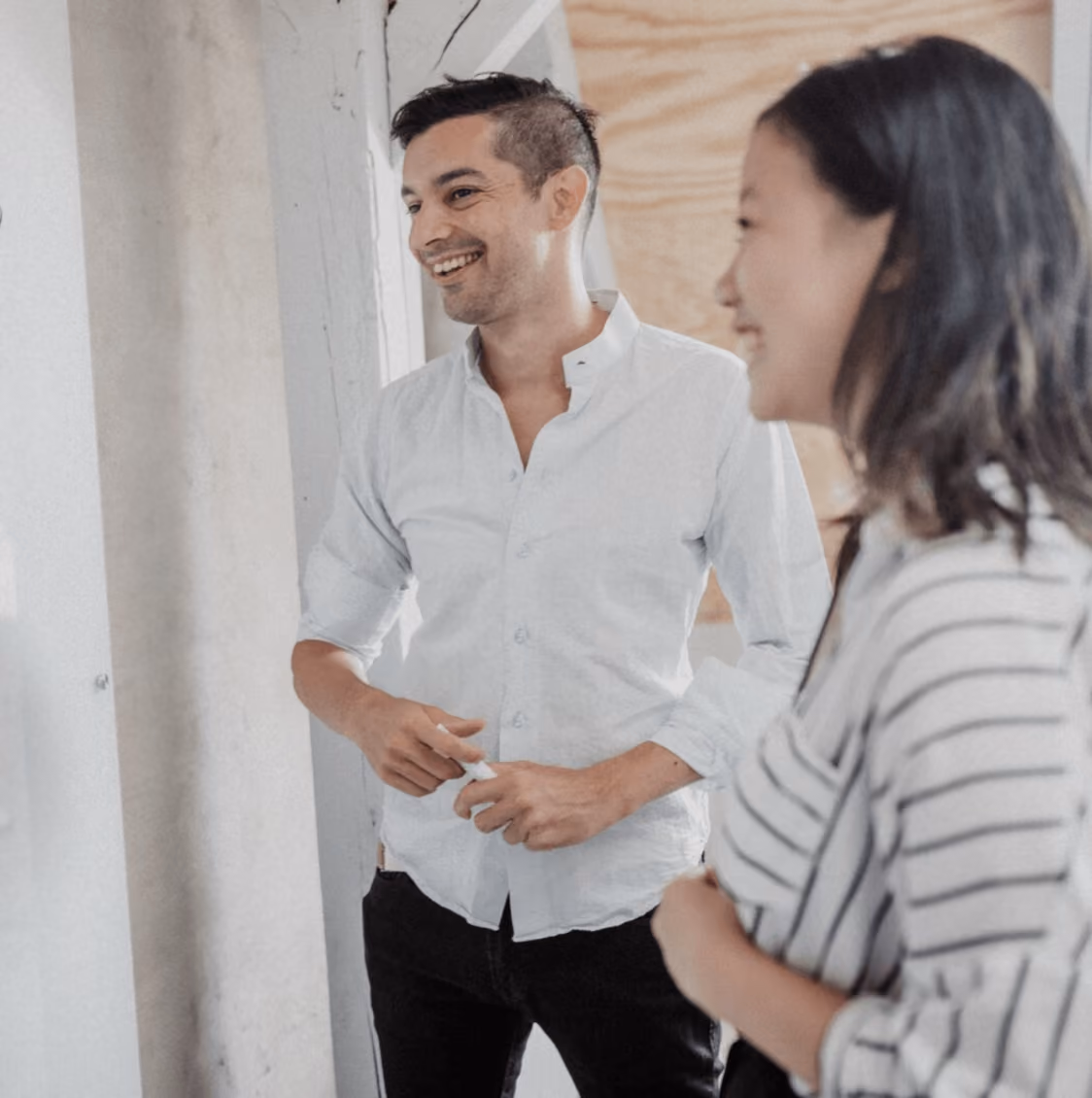 Young man and woman are talking and smiling