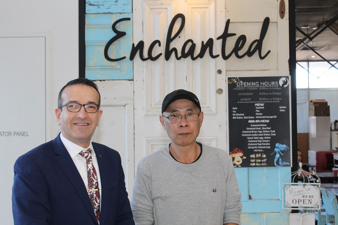 Tony Piccolo with Enchanted Café owner Duc Phan.