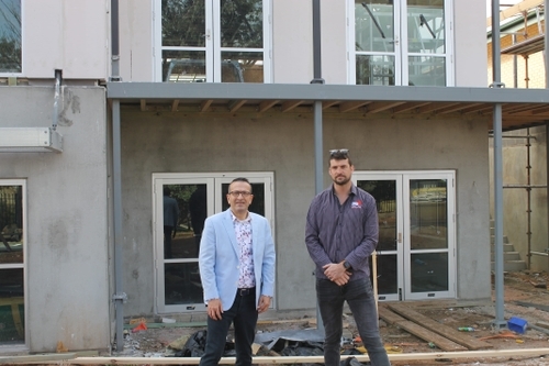 At a local project delayed because of timber shortages is Tony Piccolo MP and Nathan Shanks from GCJ Builders.