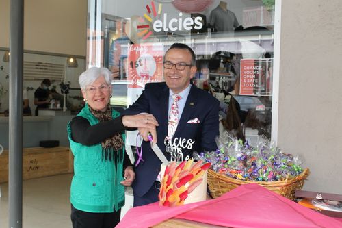 Tony Piccolo and Carol Poel cutting the cake to celebrate Elcies first birthday