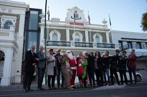 At the announcement on Saturday that Father Christmas will return to Gawler for the 2024 Villawood Gawler Community Christmas Parade are from left: Andrew Goodsell (Acting CEO Town of Gawler), Kevin Fischer (Chair, Gawler Business Development Group), Emmanuel Kontos and Criag Markam (Villawood Properties) Christmas Reindeer (Maureen McKenzie), Father Christmas, Janelle Morton (Mitre 10 Gawler), Christmas Elf (Glynnis Clothier), Mayor Karen Redman (Town of Gawler), Bronwyn Anderson (Beyond Bank), Bronte Rhodes (Gawler Apex Club), Isaac Thompson and Jai Campbell (Event MC’s Gawler and District College) and local Member of Parliament, Tony Piccolo).