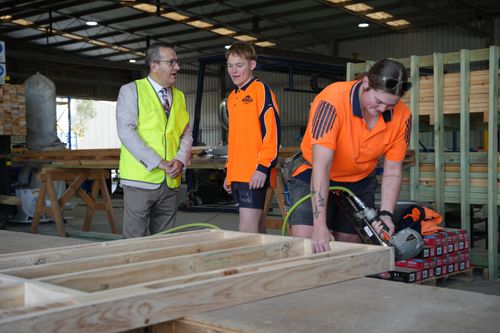 Local MP speaking with apprentice Mitchell Trimboli while apprentice Kimberley Hillier shows how it is done at Ruediger Prefab at Willaston.