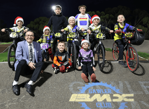 Member for Light, Tony Piccolo MP, hits the track with Gawler BMX Club members: Back – Rylie Matthews and Korbin Thomas. Centre – Nate Chamings Halle Boxall, Ethan Boxall, Lawson Chamings, and Riley McDermott. Front – Kaiden Marshall- Sachse and Ollie Borg.
