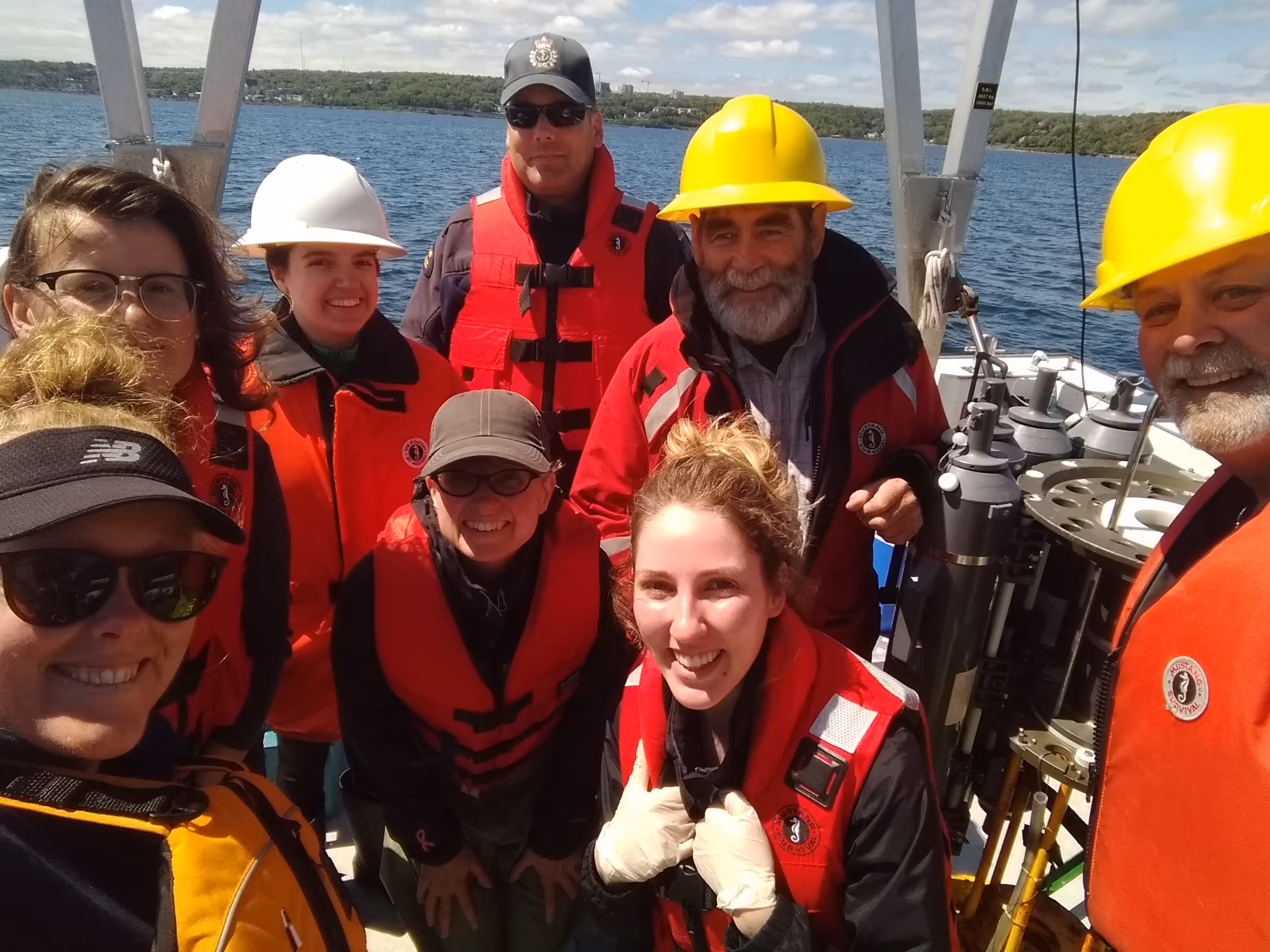 Group photo of researchers on a boat in the Bedford Basin.