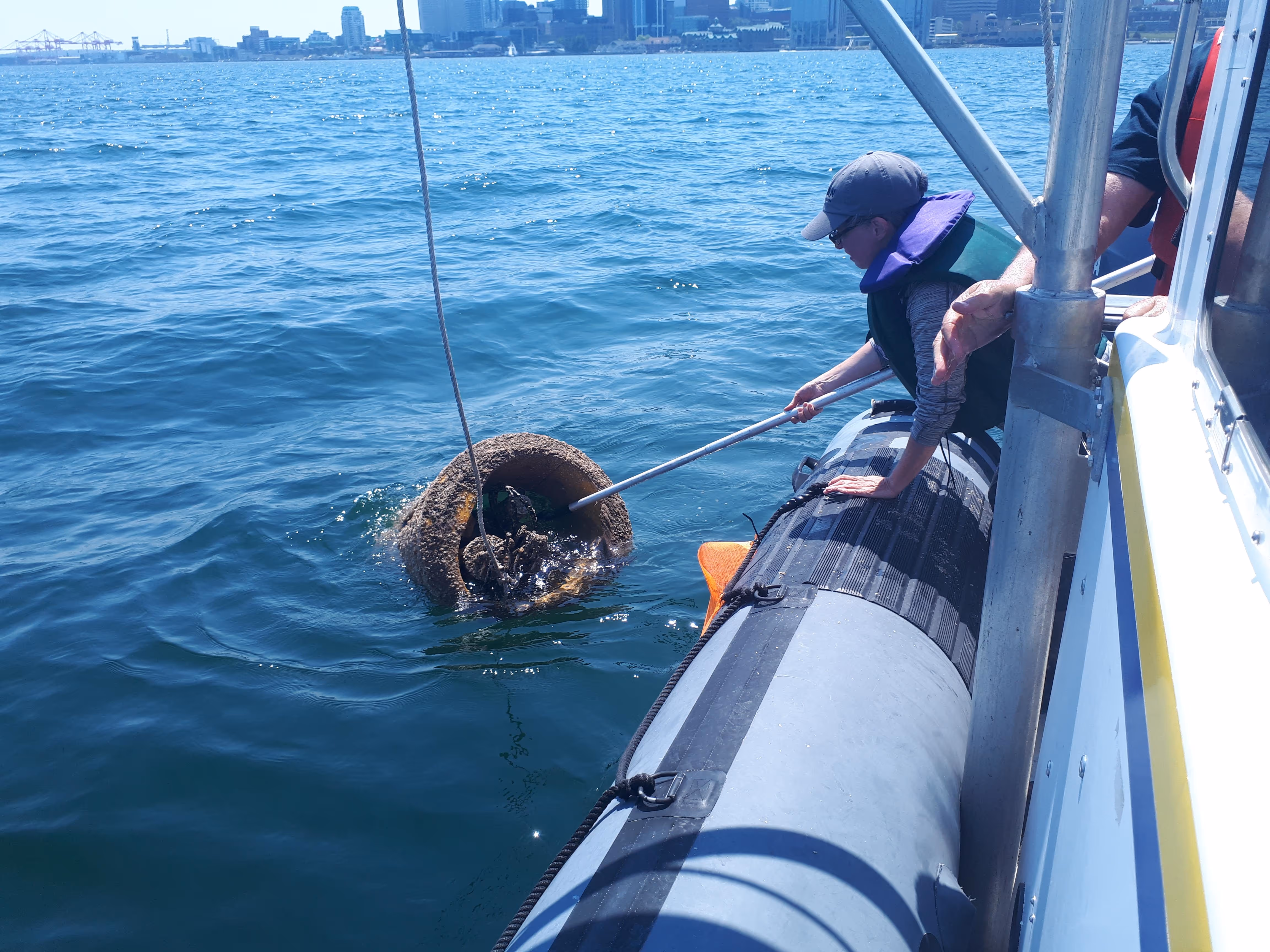 pulling oceanography equipment onto a boat.