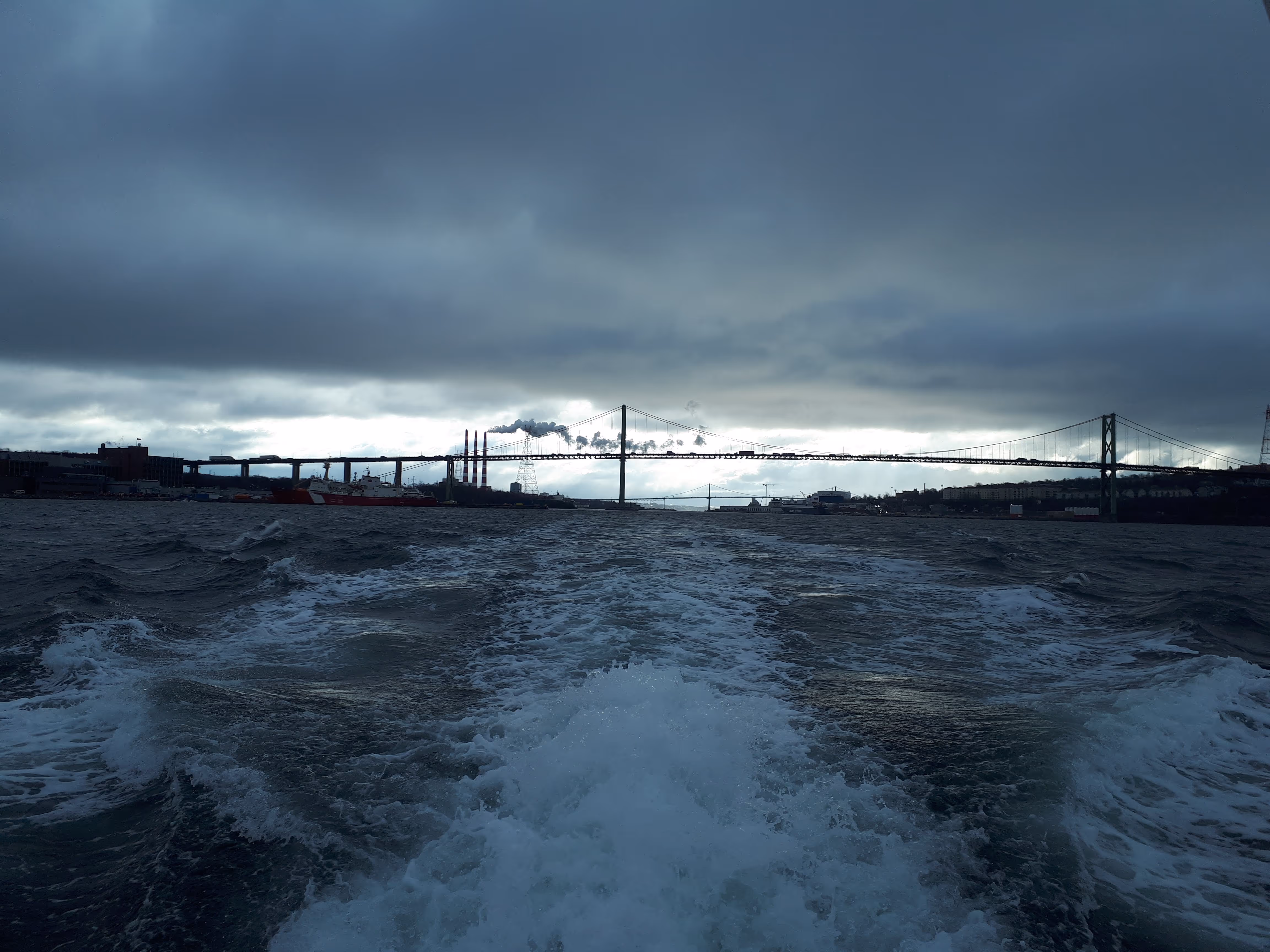 Boat making waves in the Bedford Basin.