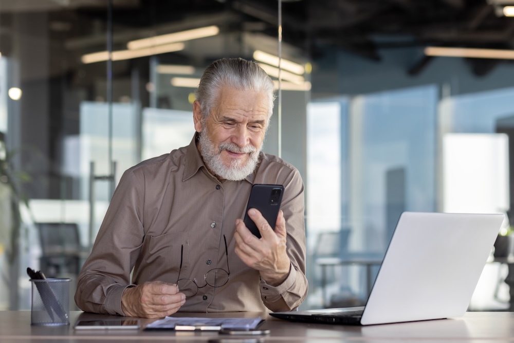 professional man at desk on phone call