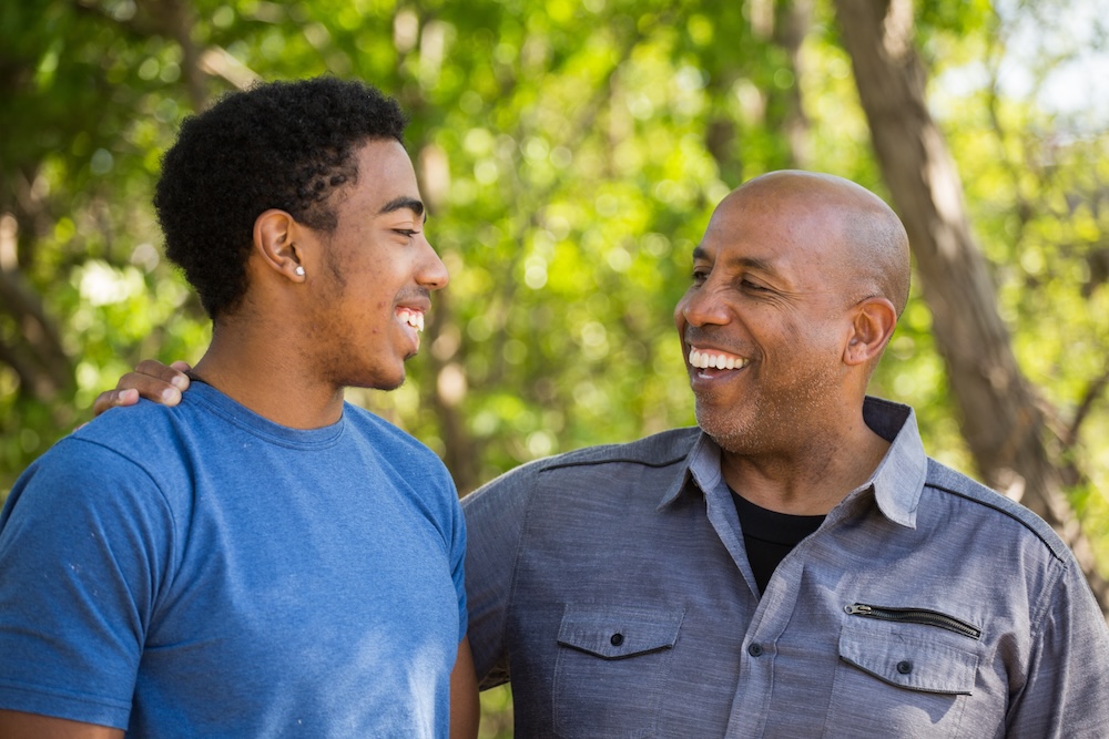 father and son chatting outside