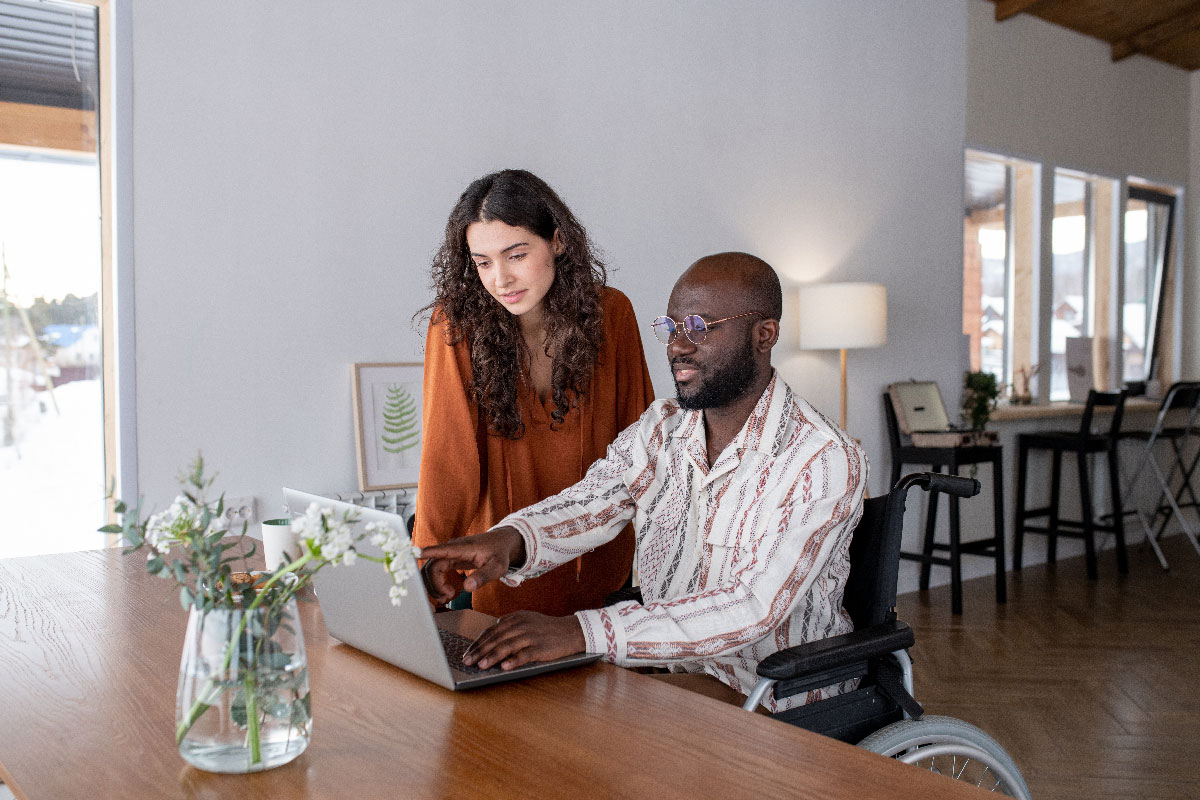 Man and woman looking at laptop