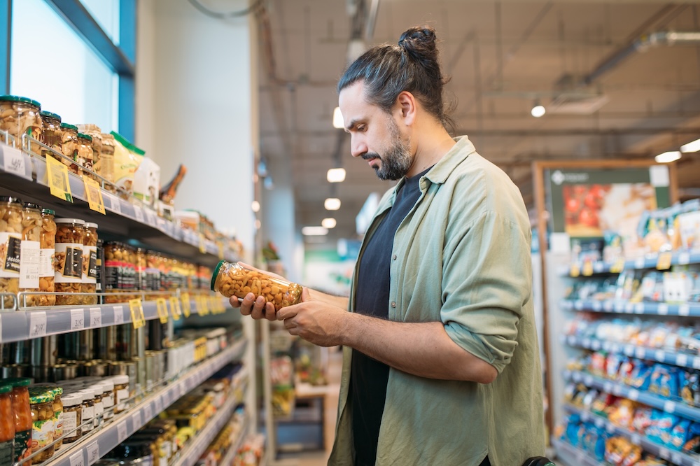 man shopping for food at a store