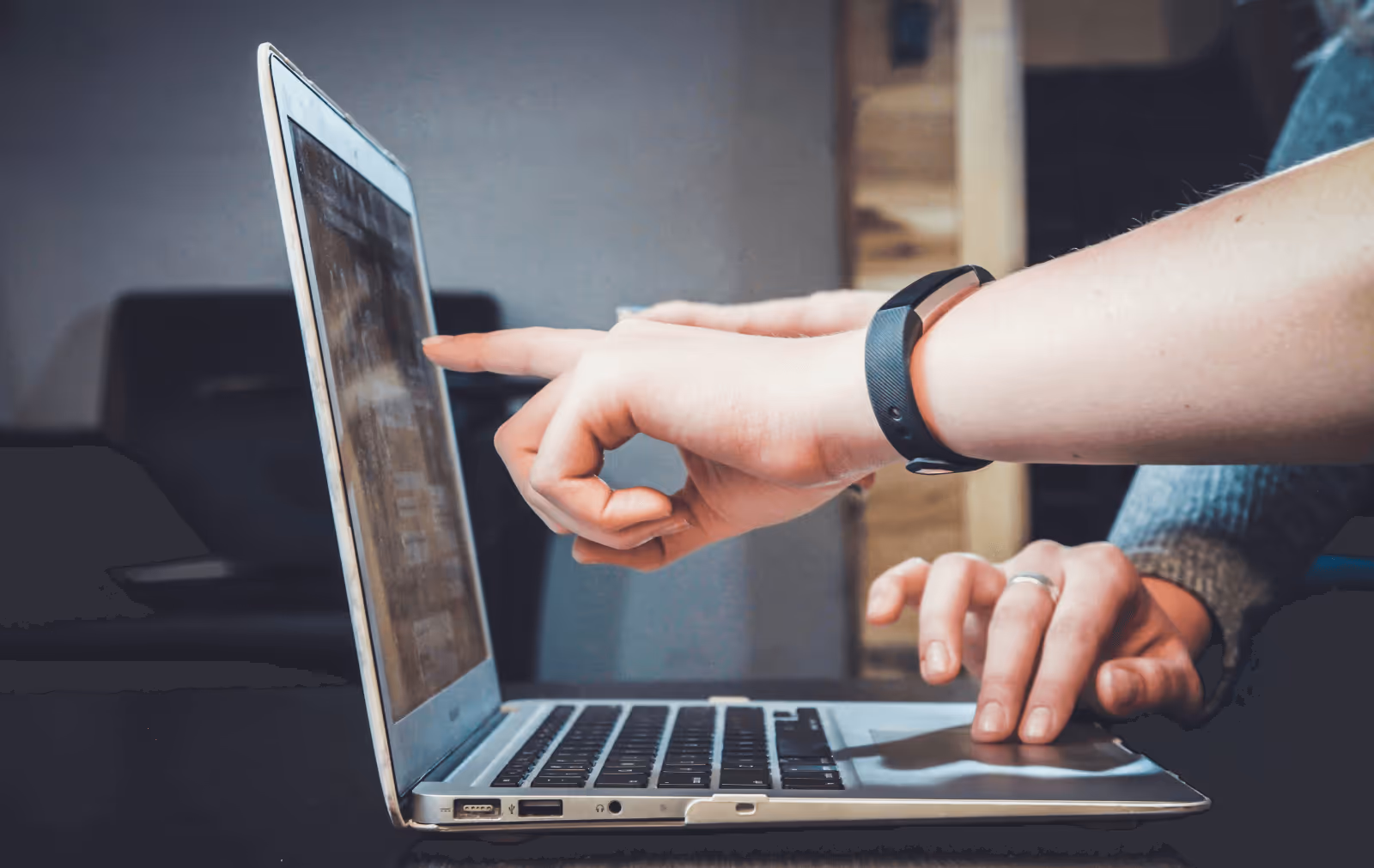 Close-up of two people evaluating a fashion B2B marketplace platform on a laptop - illustrating the decision-making process for choosing the best wholesale solution for fashion brands.