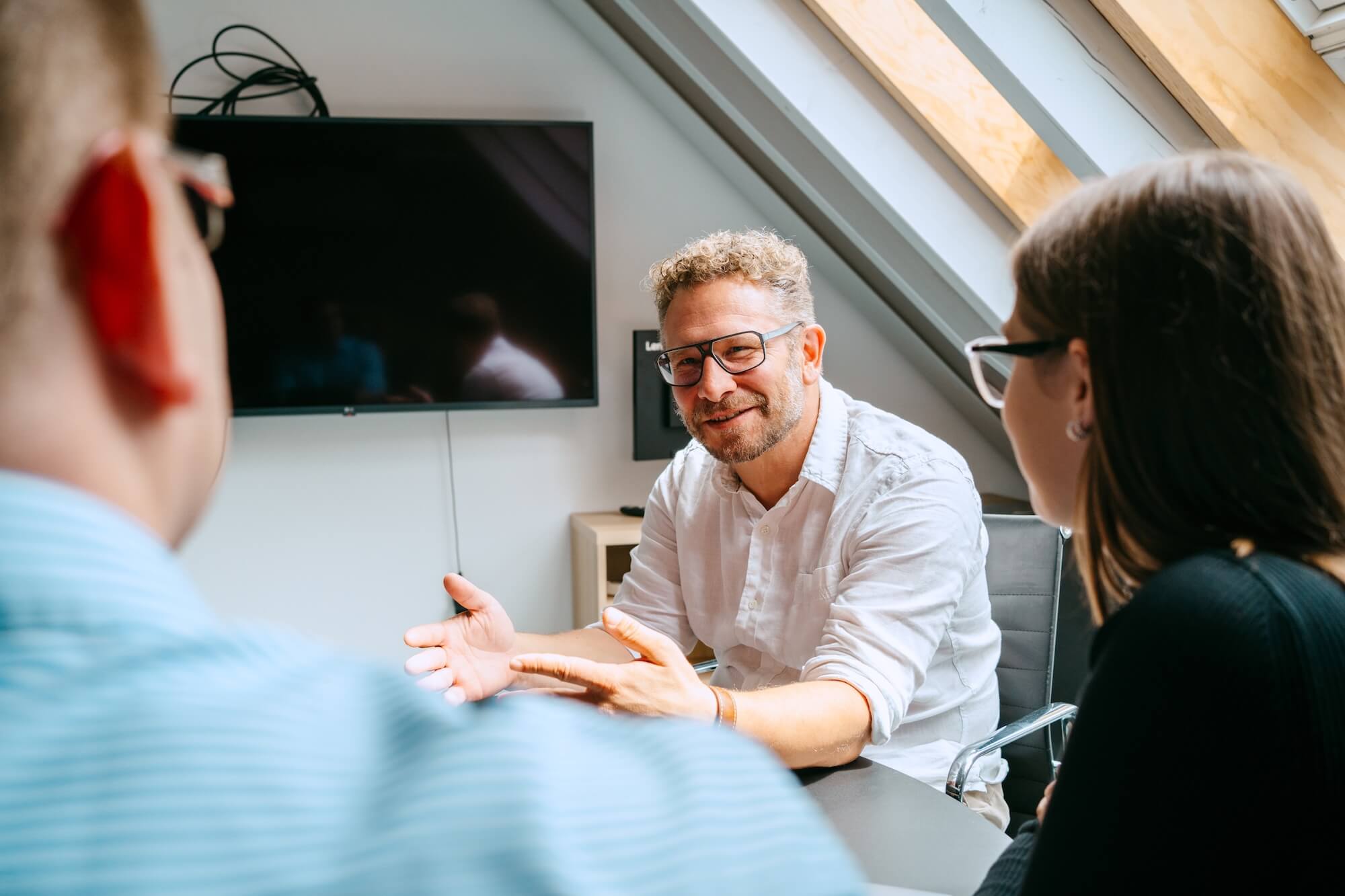 Leader in a business meeting with his employees