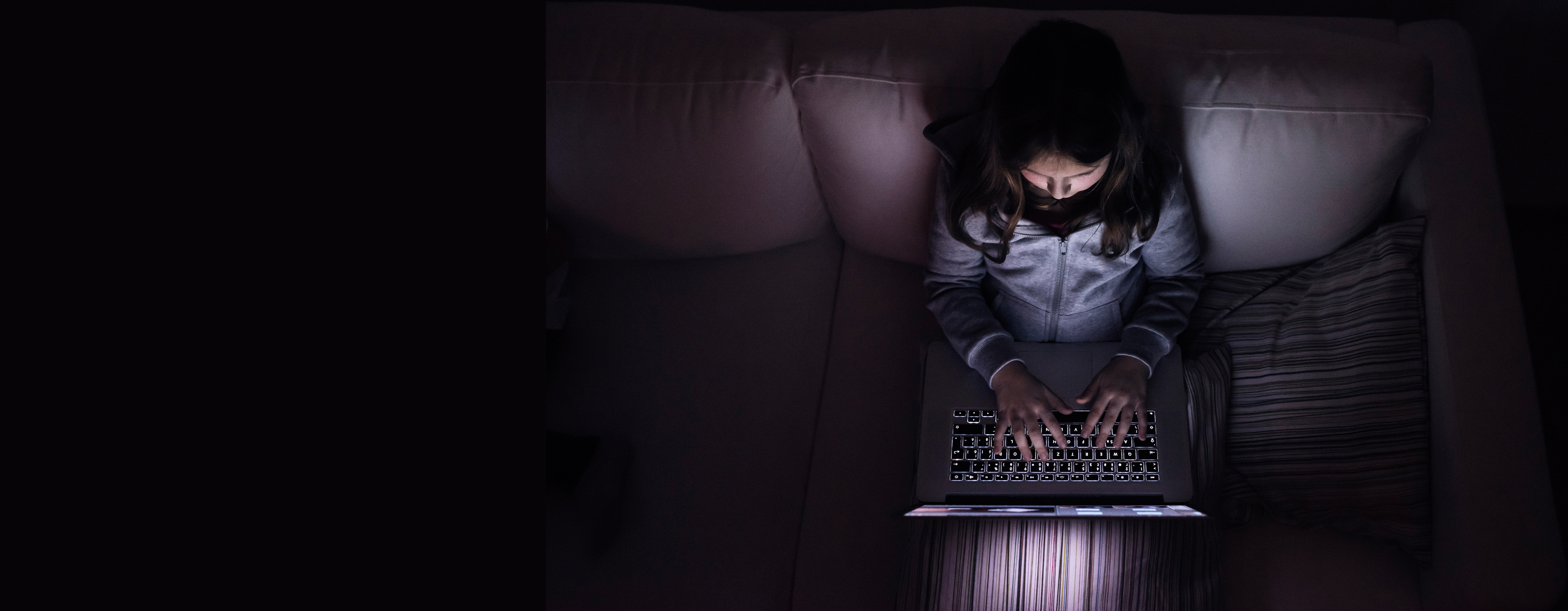 A child holding her forehead with a sad expression