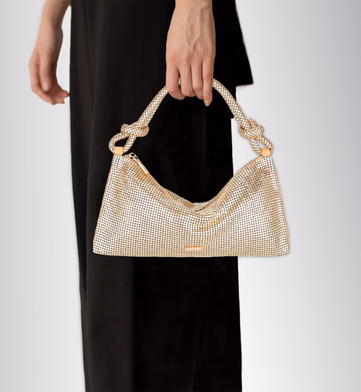 Model holding a handbag