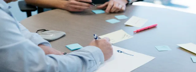 writing at conference table