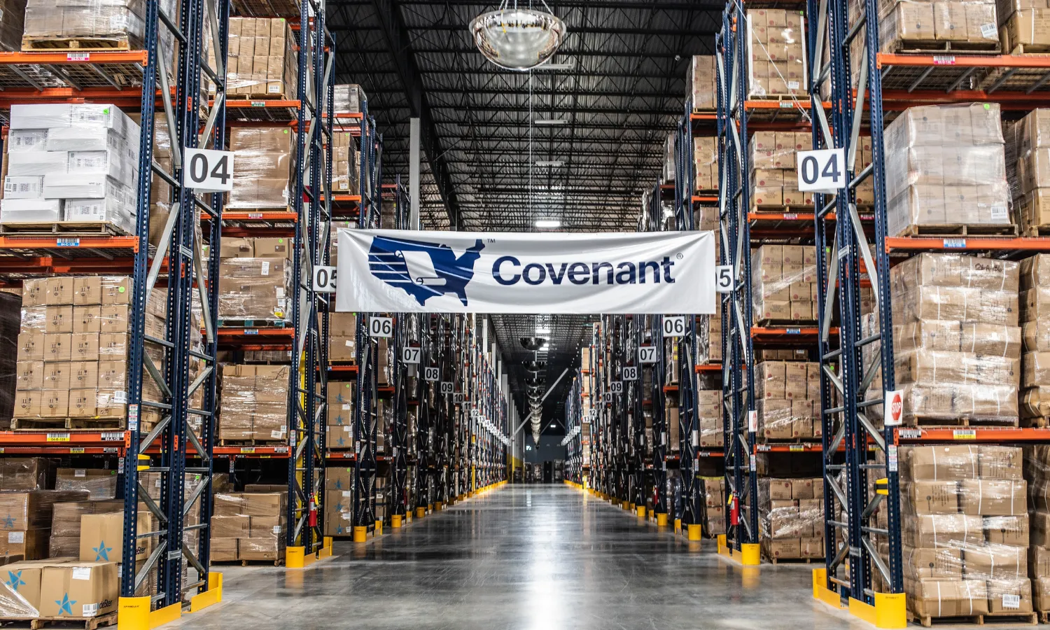 A warehouse with a Covenant Logistics banner hanging in the center