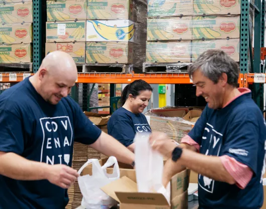 Workers unpacking boxes in a warehouse