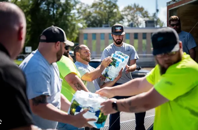 A truck full of water jugs