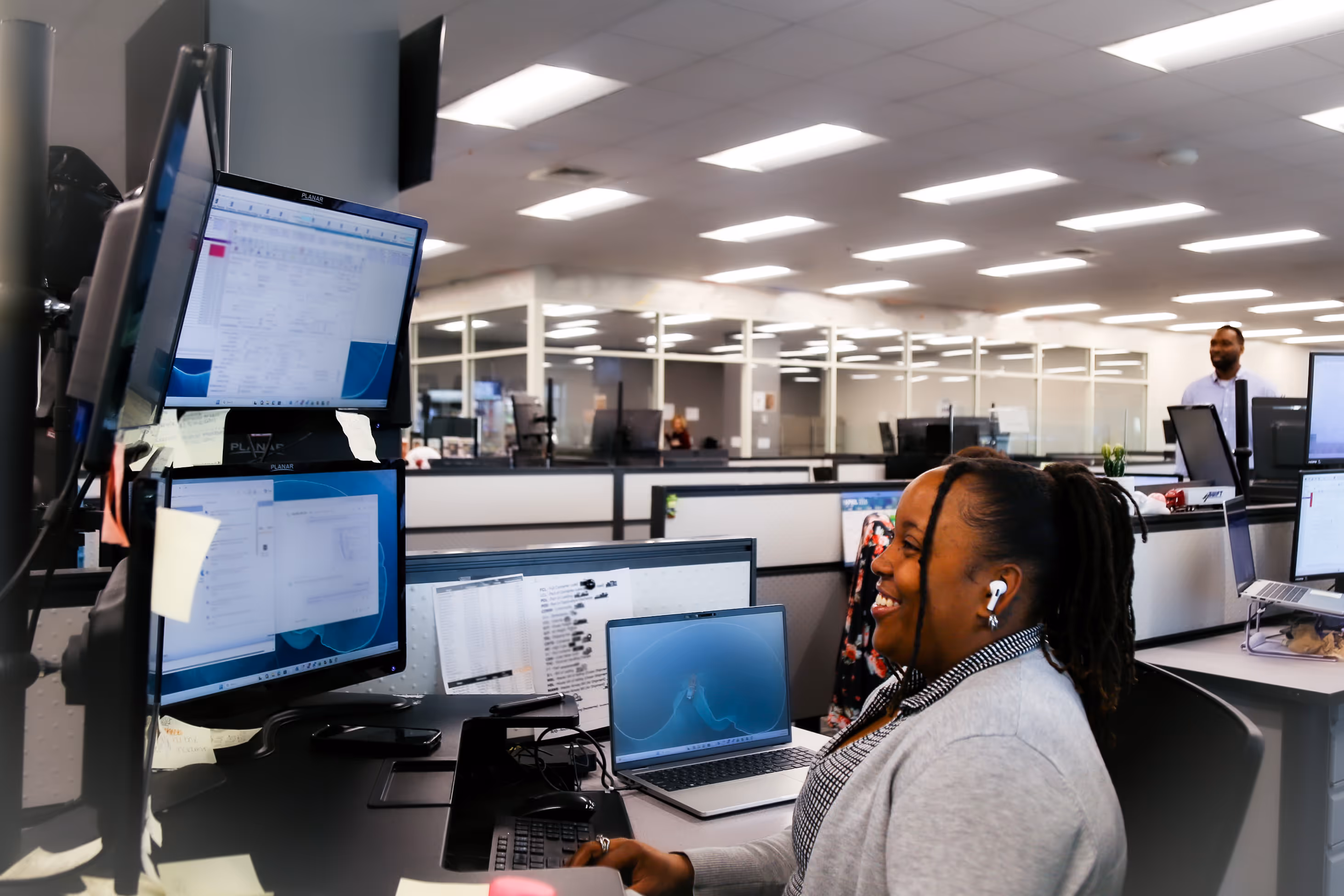 A Star Logistics brokerage team member working at her desk