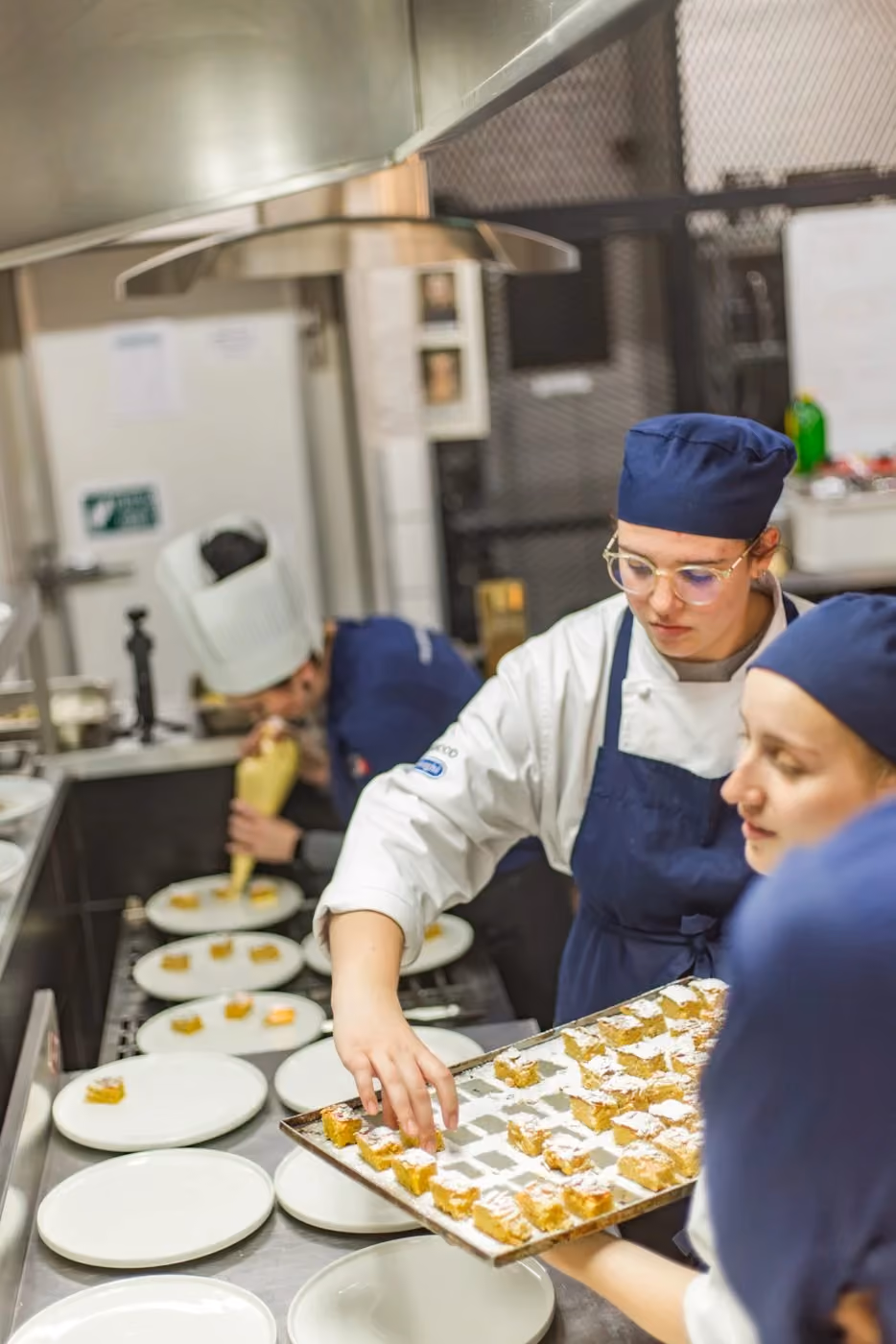 CHS students piping and setting pastry together