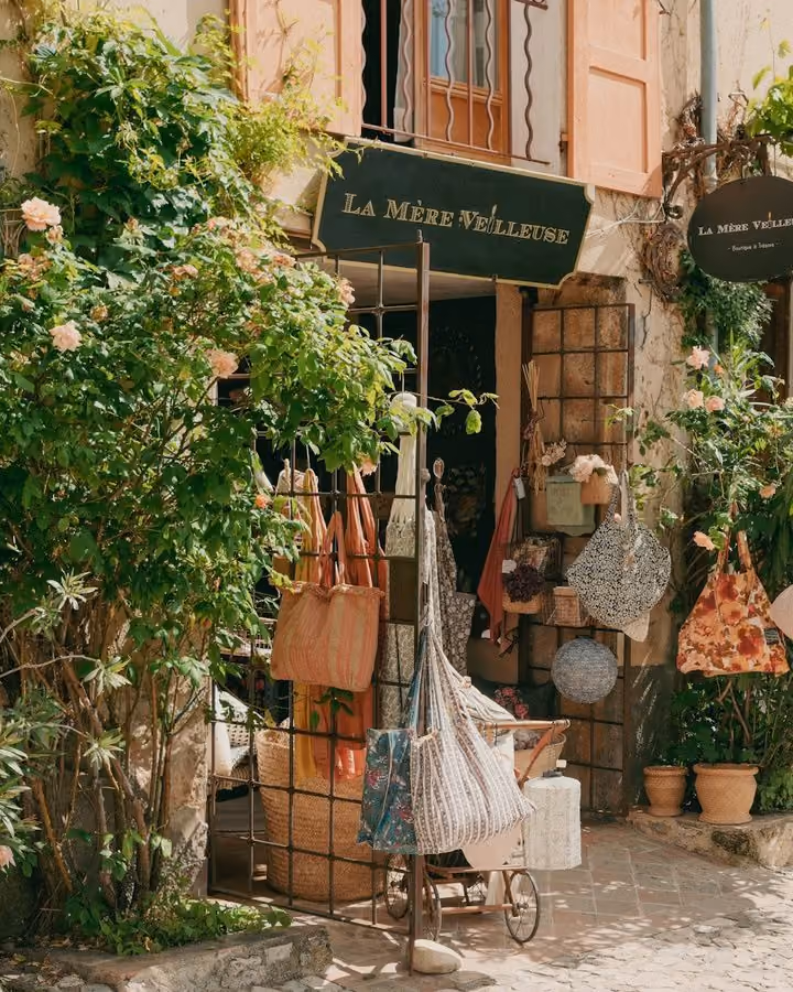A small shopfront with climbing roses