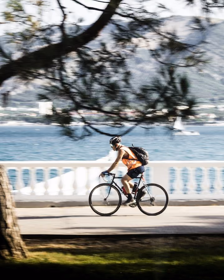 A cyclist on a seafront promenade