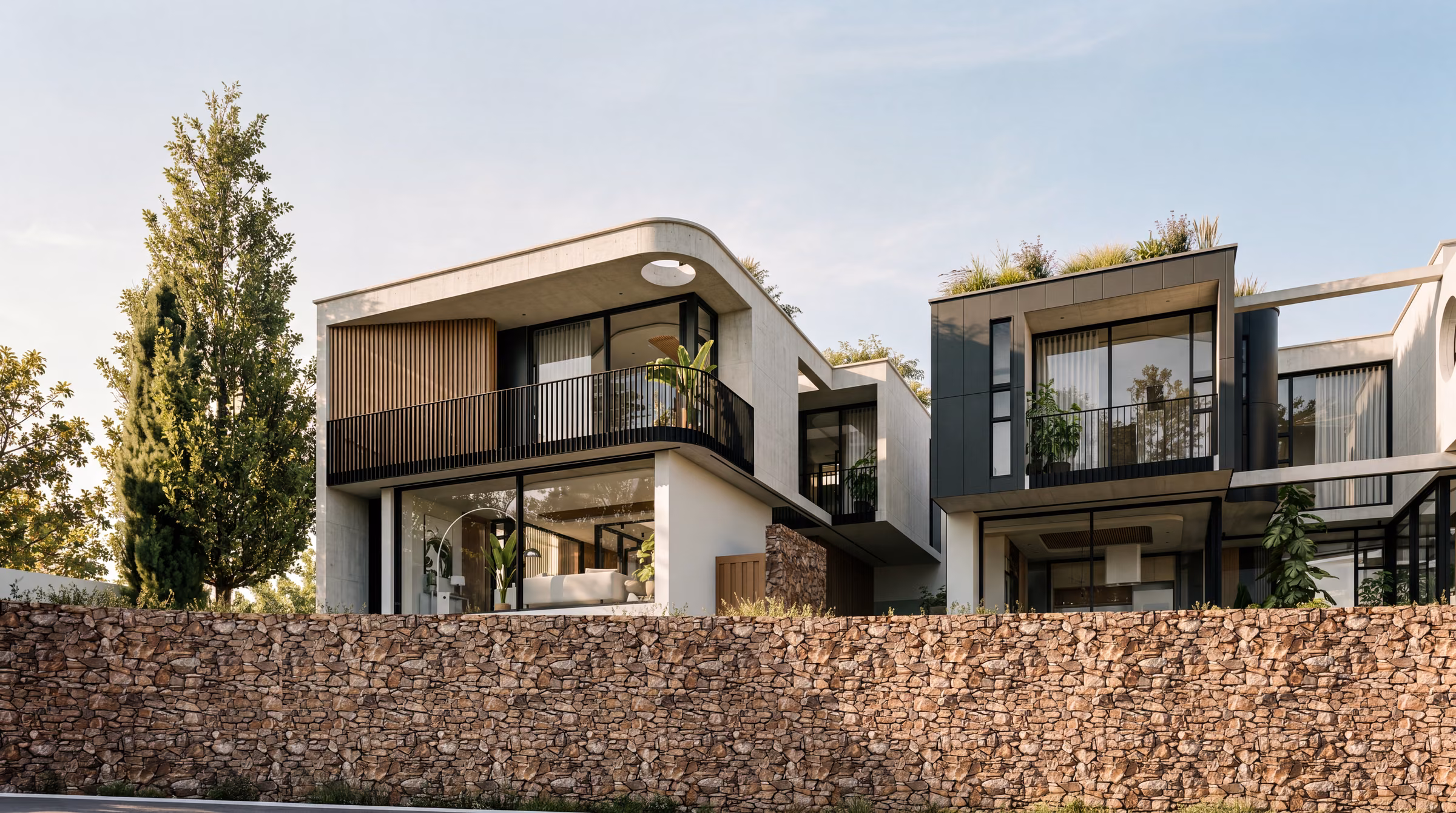 Front homes at Sanford Heart above the stone street wall