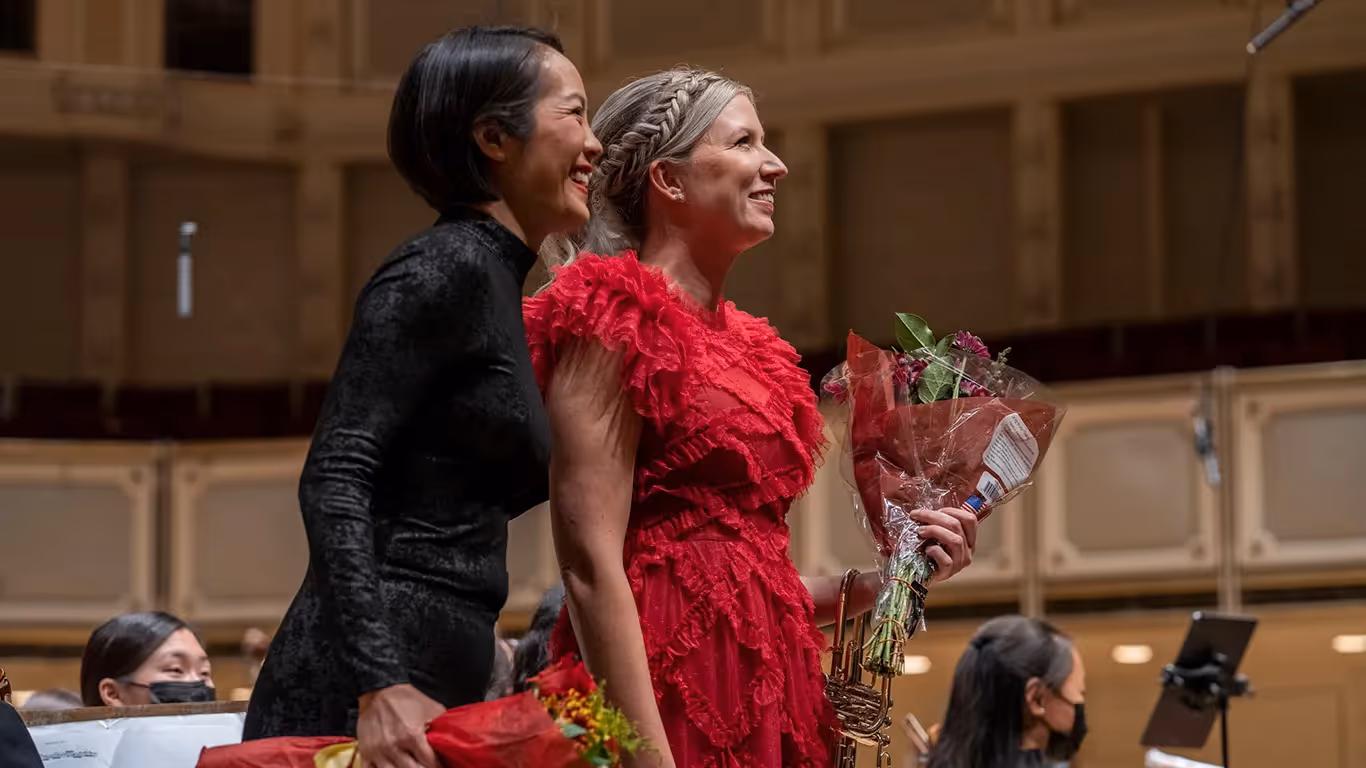 Mary Elizabeth Bowden and Vivian Fung take a bow with the Chicago Youth Orchestras
