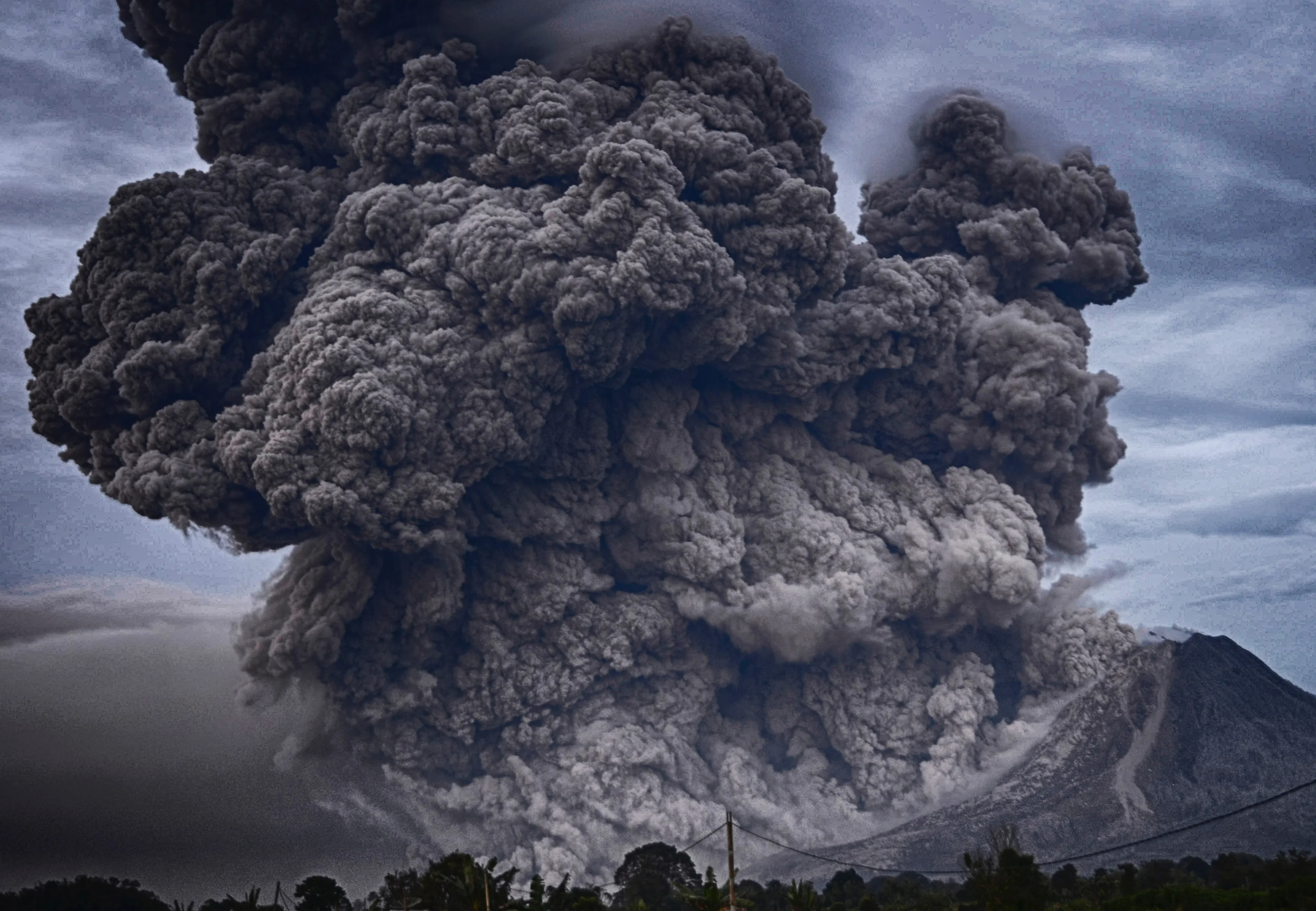 Volcano eruption letting off a massive cloud into the sky