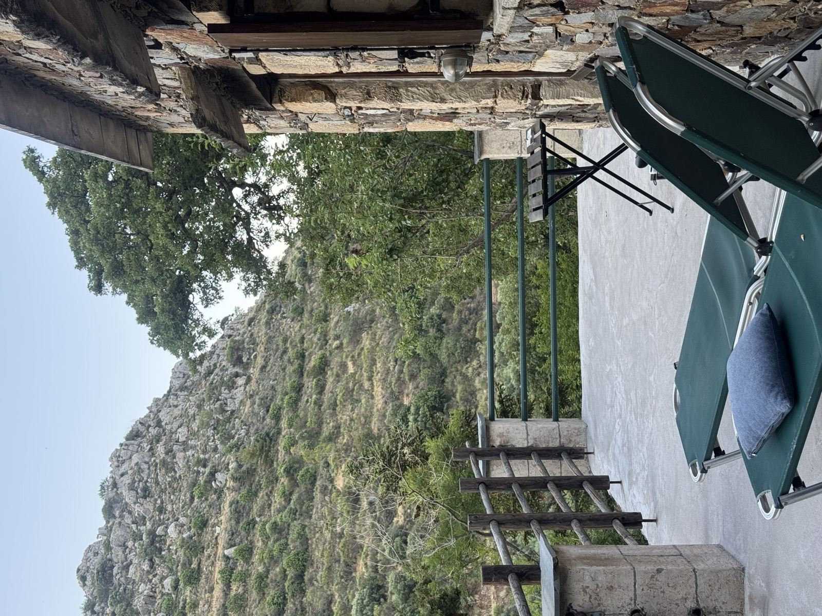 Terrace of a restored stone room at Milia Mountain Retreat