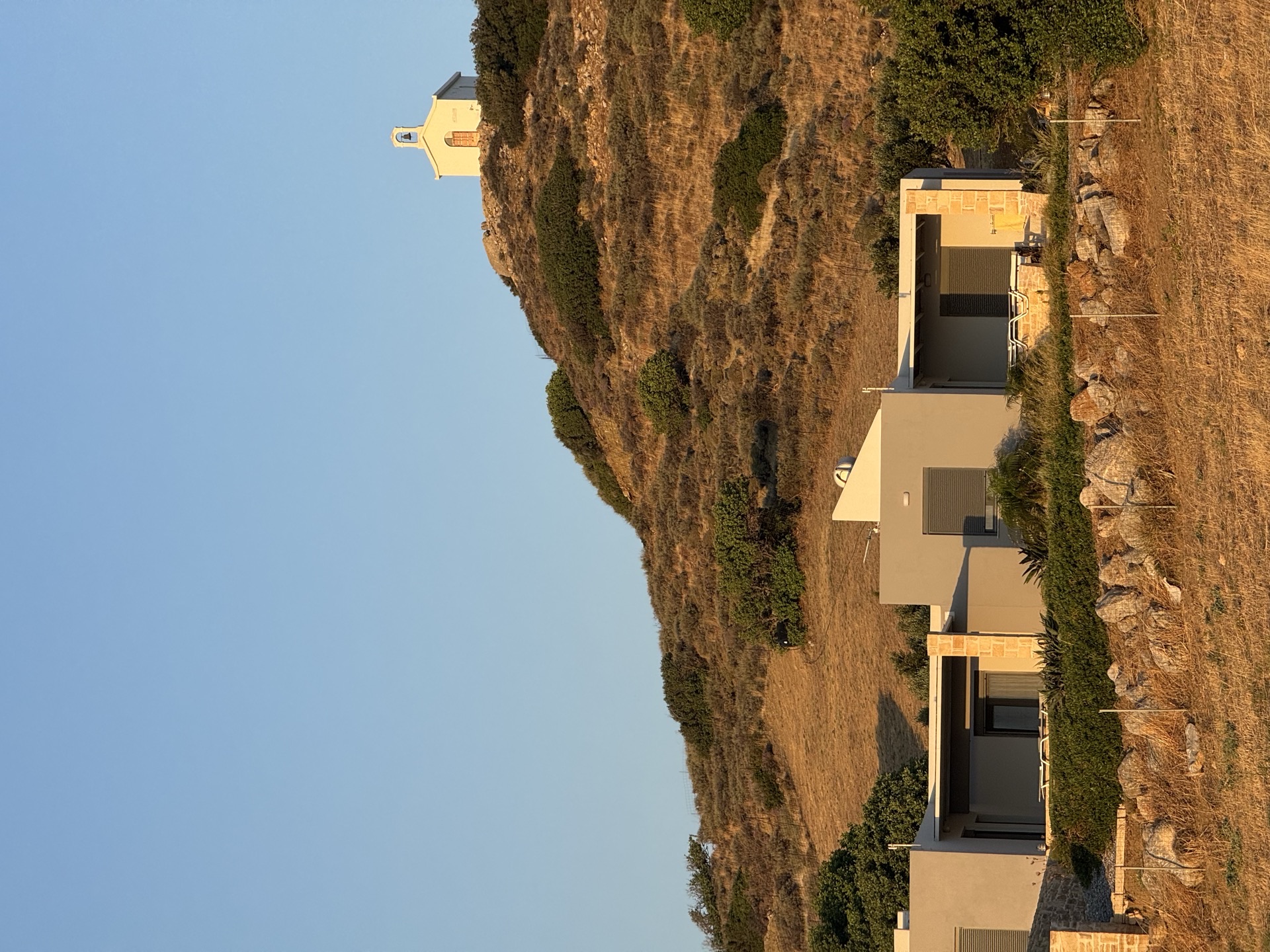 Triopetra south-coast house below the hill chapel, Crete, June 2026