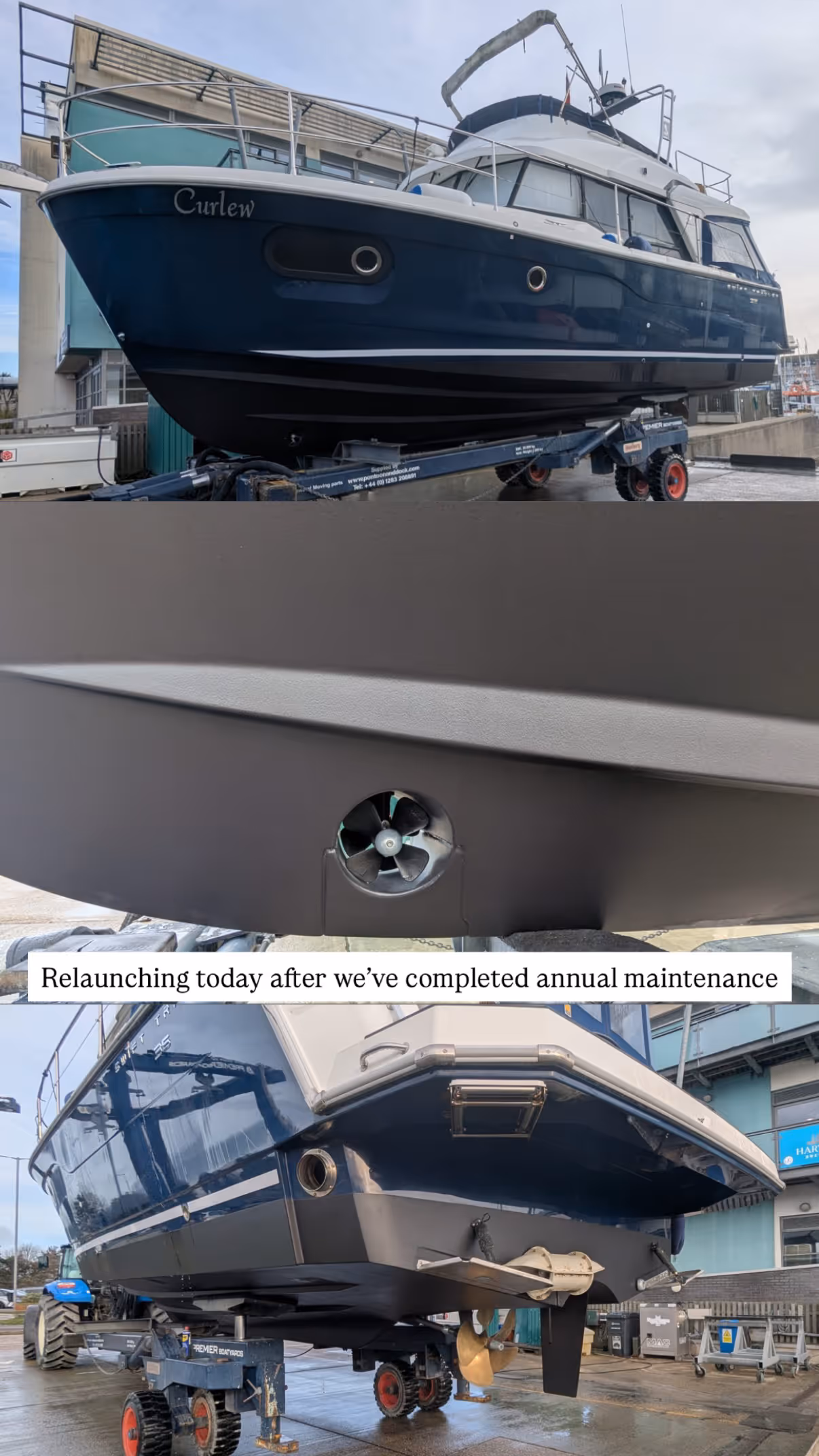 A blue and white boat is on a platform for maintenance in a shipyard.