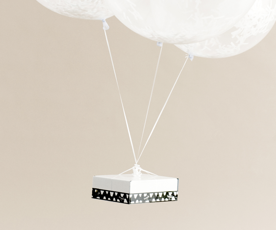 A Dopple Drop box arriving via large balloons.
