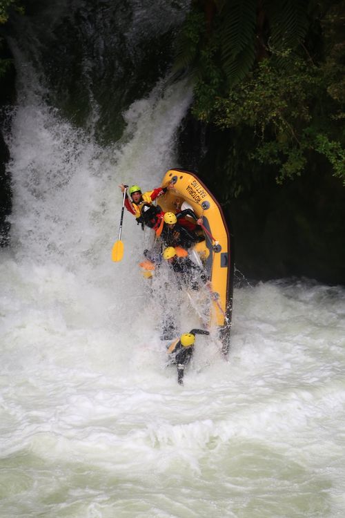a raft about to flip over after going down tutea falls on the kaituna river