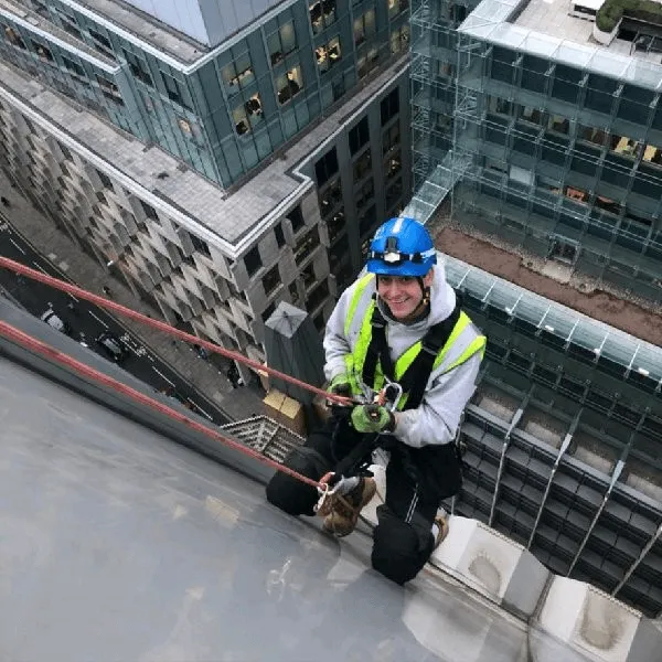 Rope Access Manager performing Commercial Glazing Maintenance