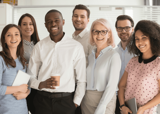 Group photo of seven smiling staff members. 