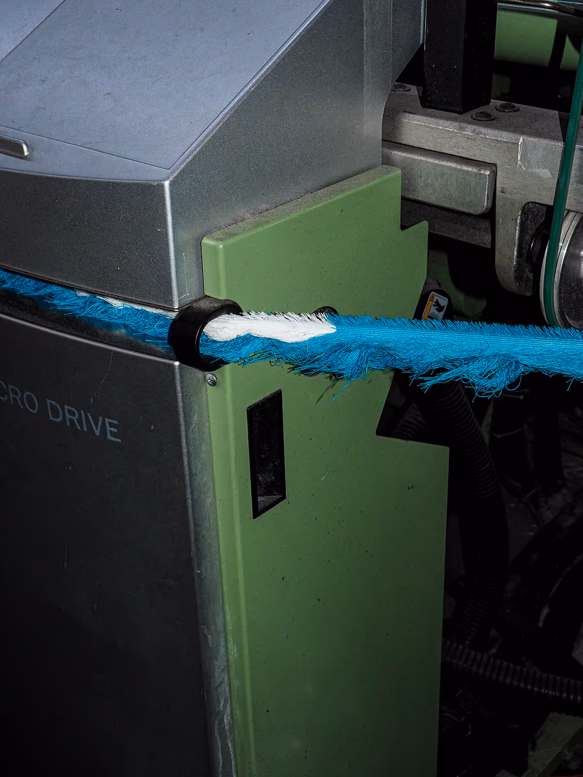 Pulling threads - Stem textile being created.
