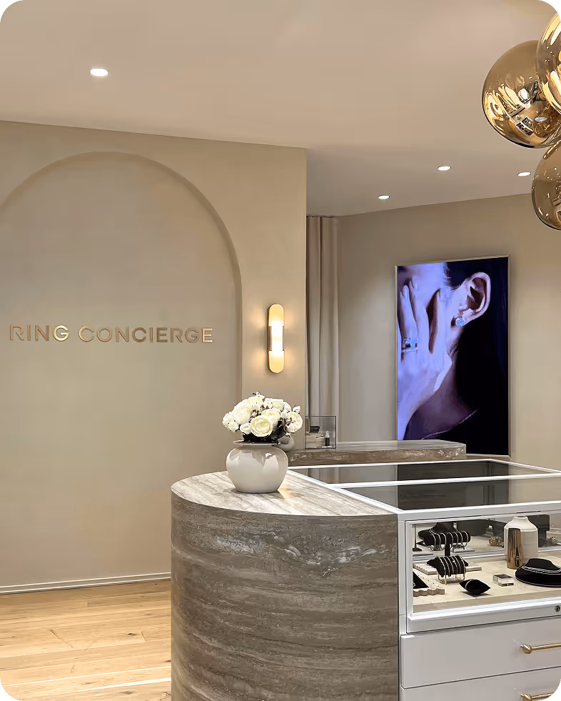 A room with a counter and a television in the background.