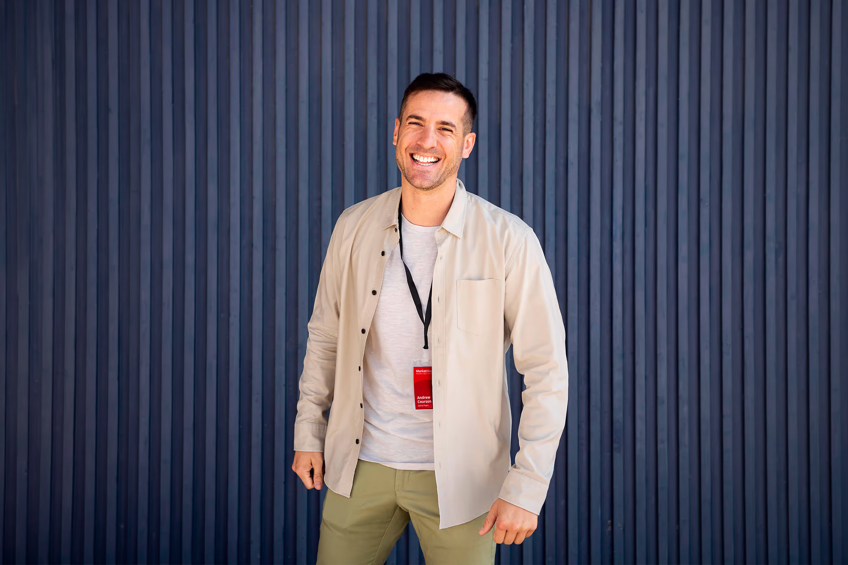 Large billboard on side of building promoting upcoming MarketMasters event, featuring speaker, Andrew Perrie