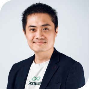 Portrait of Liu Tian Wei, team member at StraitsX, dressed in a navy blazer against a neutral background.