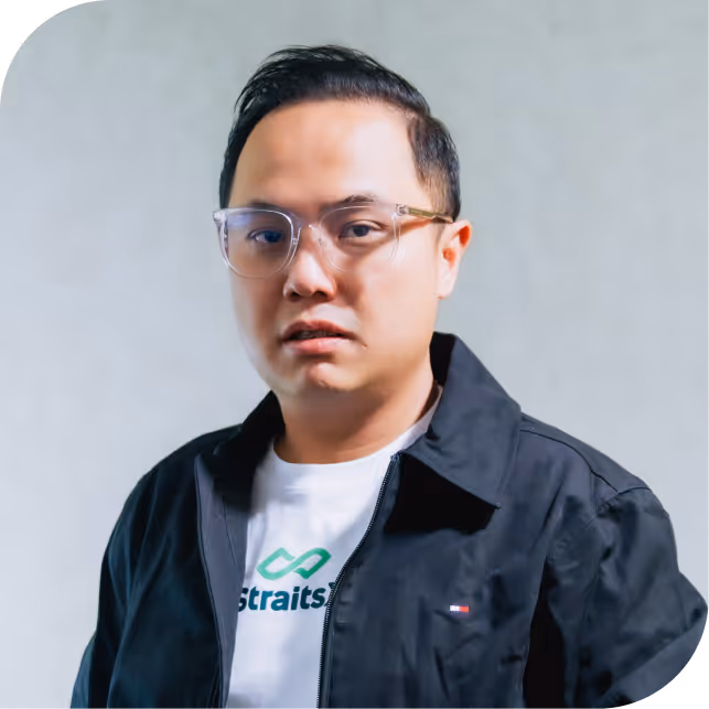 Portrait of Hendoko Kwik, team member at Fazz, dressed in a black blazer against a neutral background.