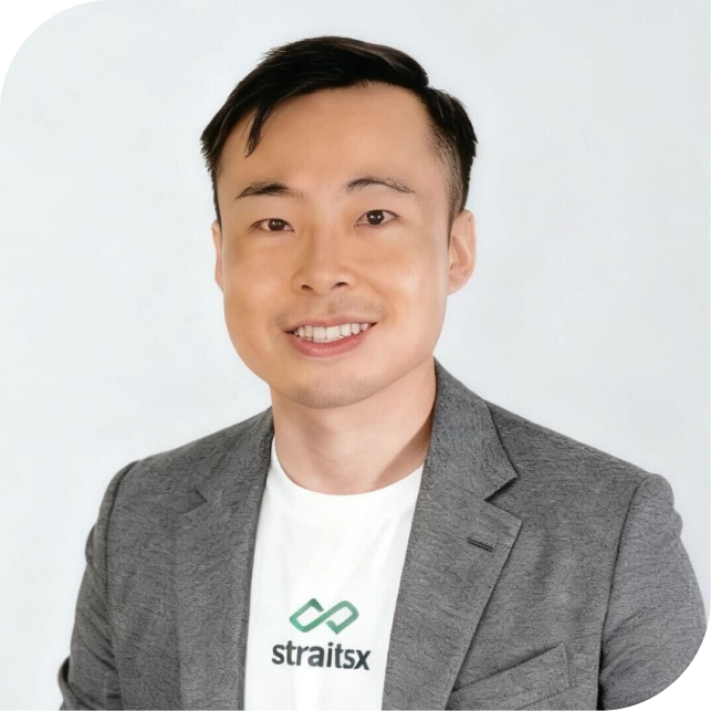 Portrait of Melvin Seah, team member at StraitsX, dressed in a grey blazer against a neutral background.