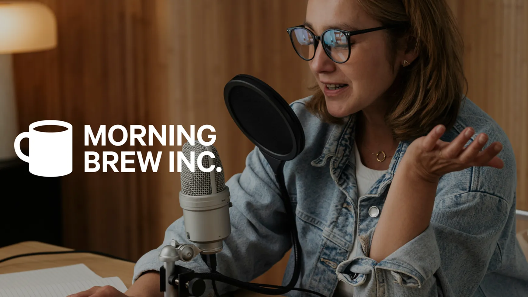 morning brew logo on top of an image of a woman doing a podcast