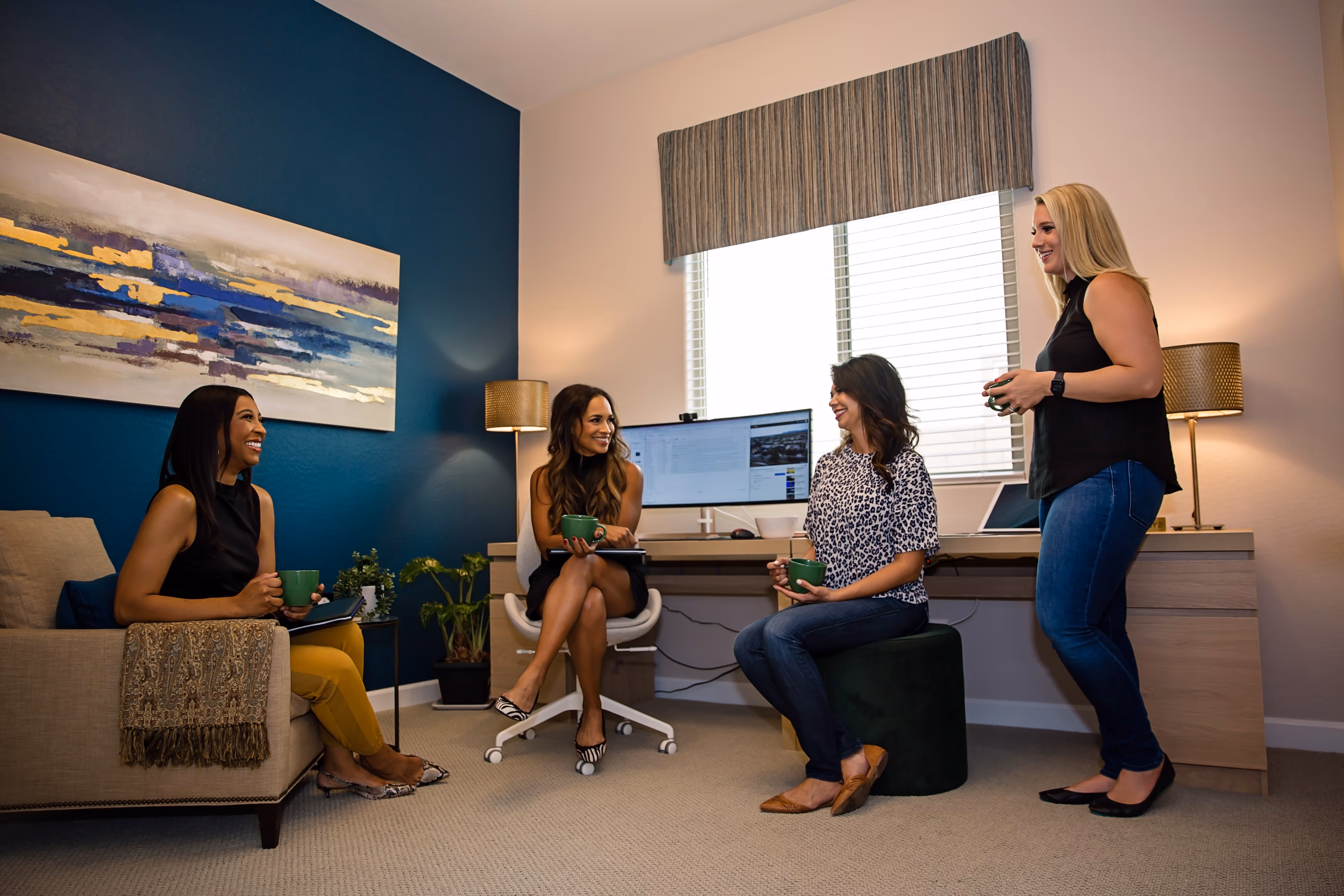 4 ladies sitting and having coffee