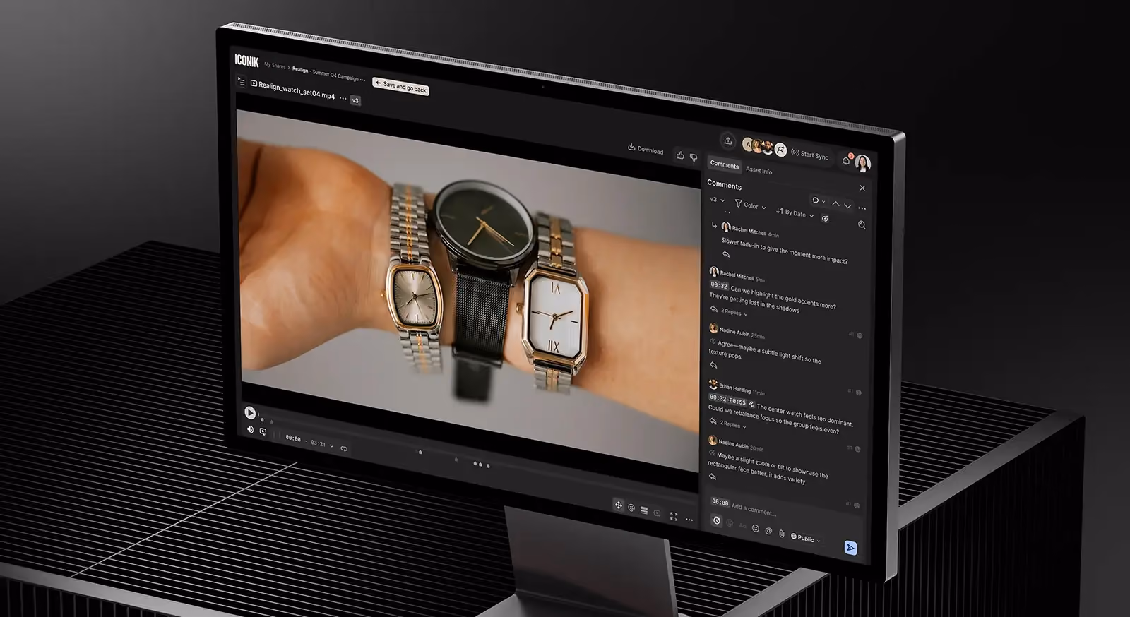 Desktop monitor showing a video review interface for a watch advertisement with a sidebar of threaded team collaboration comments.