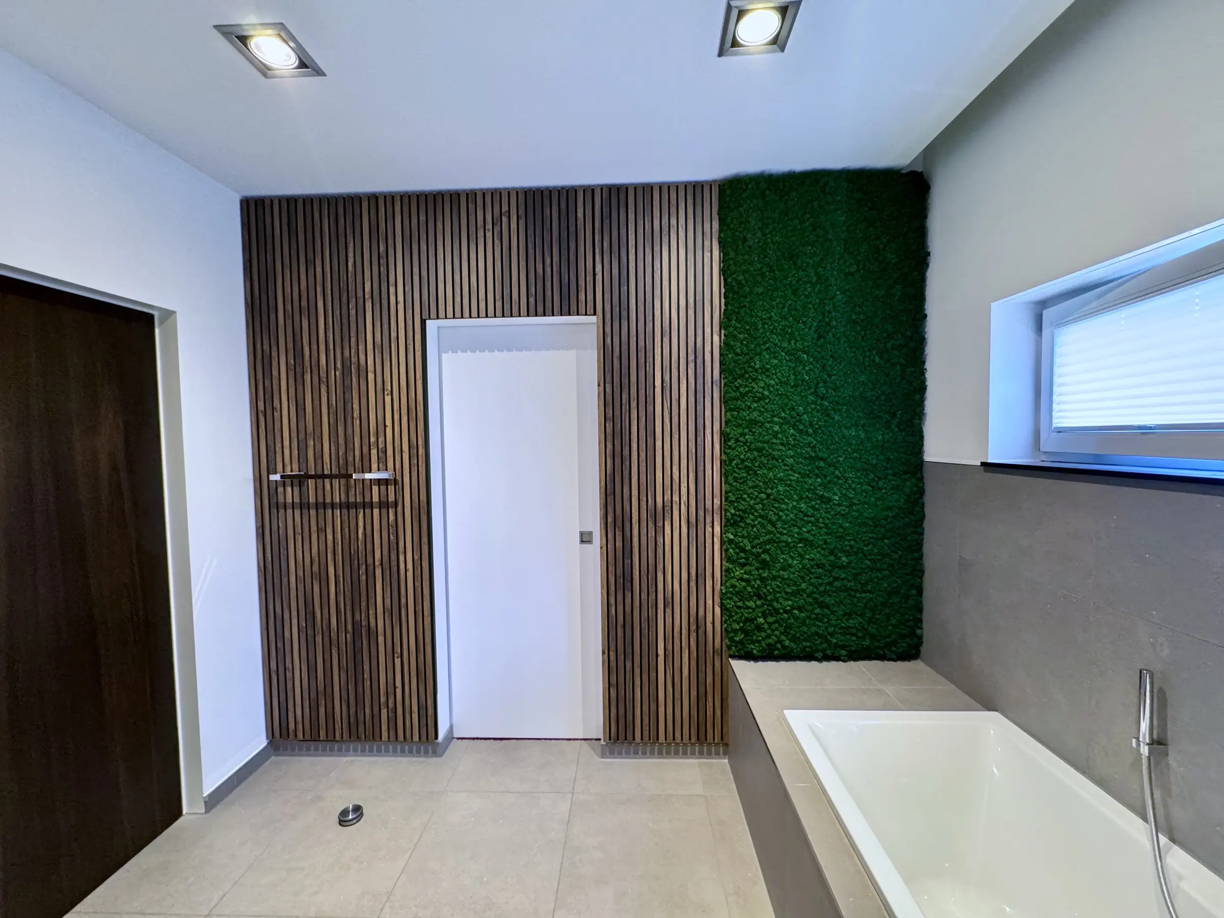 In addition to the moss wall, we built a custom wall panel with ventilation specifically designed for humid bathroom conditions
