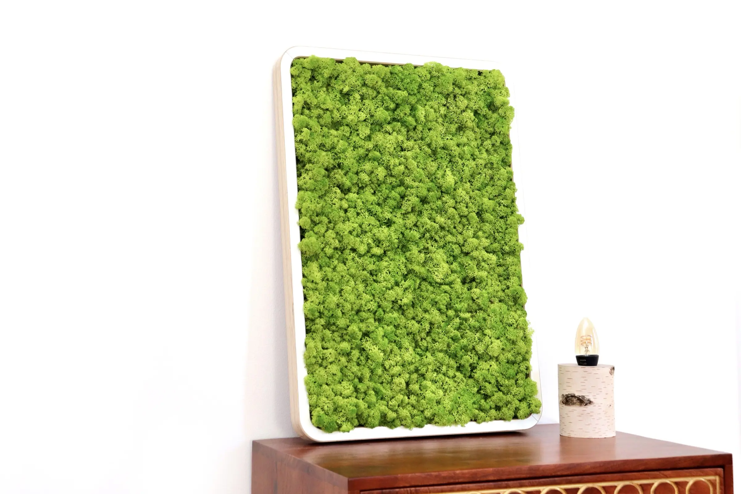 CNC-milled frame from white-coated multiplex, filled with preserved island moss for a vibrant green oasis effect