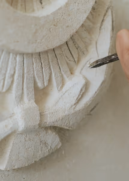 Carving on a stone by a chisel.